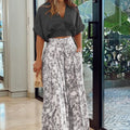 Tweedelige dames set met V-hals top en wijde broek – Mila