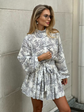 Toile mini-jurk met ballonmouwen en strikceintuur – Amelina