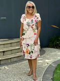 Maxi bloemenjurk met afslankend watervaldesign – Noémie