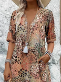 Dames midi-jurk met print en vloeiende V-hals – Aurina