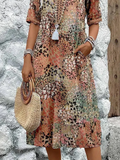 Dames midi-jurk met print en vloeiende V-hals – Aurina