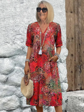 Dames midi-jurk met print en vloeiende V-hals – Aurina