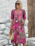 Dames midi-jurk met print en vloeiende V-hals – Aurina