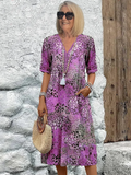 Dames midi-jurk met print en vloeiende V-hals – Aurina