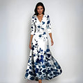 Bloemenprint wikkeljurk met V-hals en tailleband – Emilia