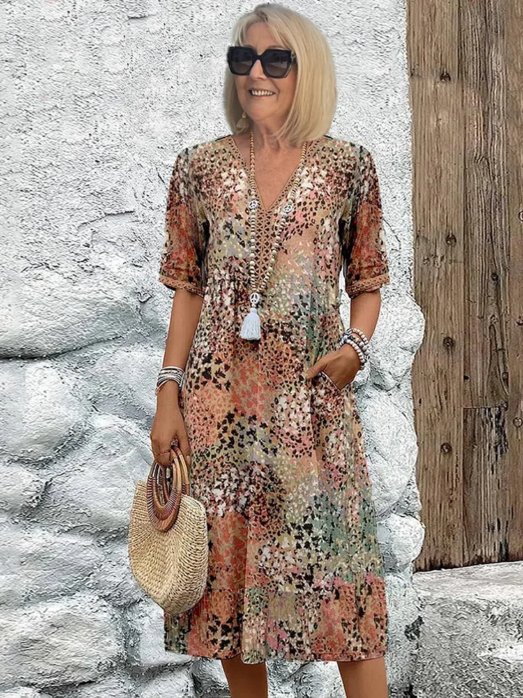 Dames midi-jurk met print en vloeiende V-hals – Aurina